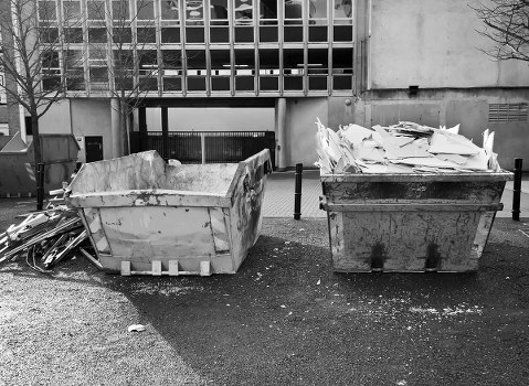 Collection crew preparing a commercial waste vehicle at a depot